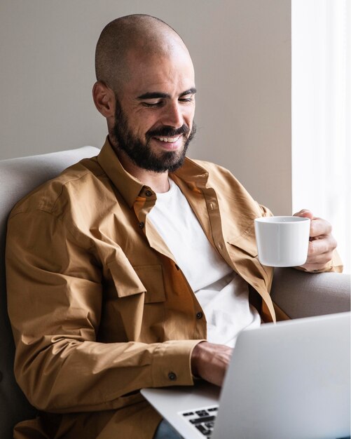 Smiley man holding coffee cup