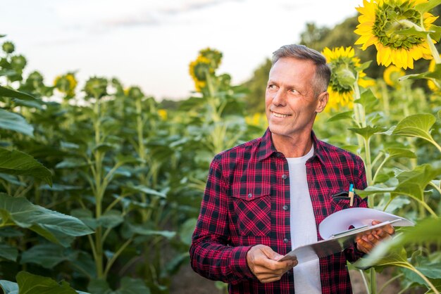 Smiley man looking away on a field