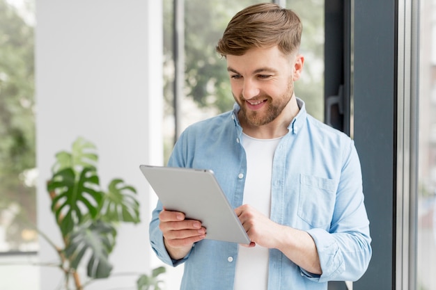 Smiley man with tablet