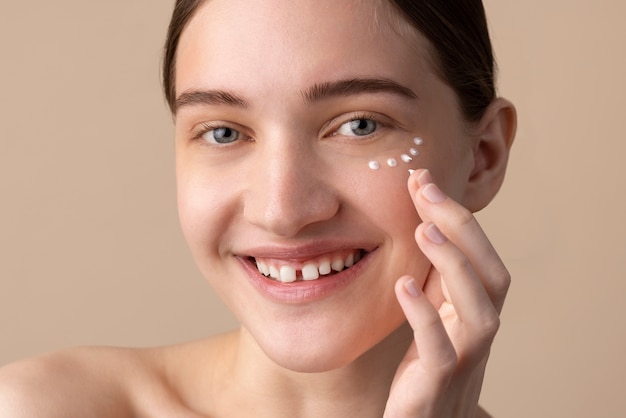 Smiley model using eye cream side view