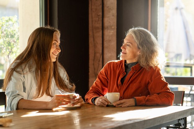 Smiley mother and daughter medium shot