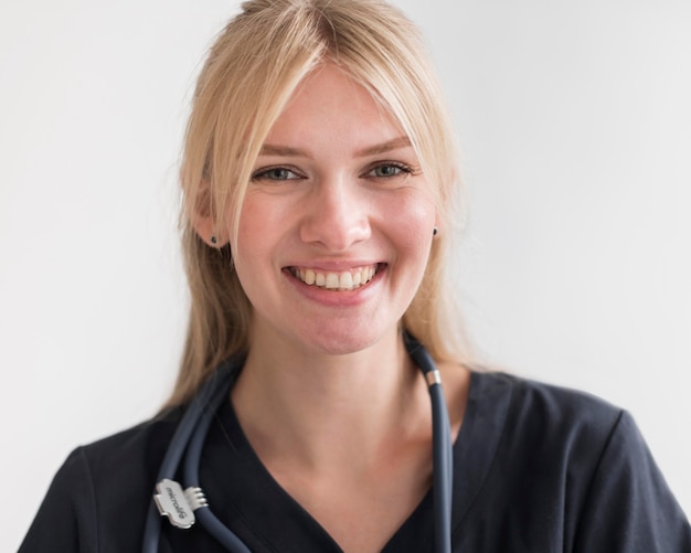 Free photo smiley nurse with stethoscope