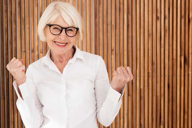 Smiley old woman with eyeglasses