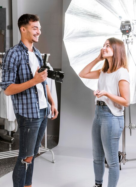 Smiley people getting ready for photo shooting