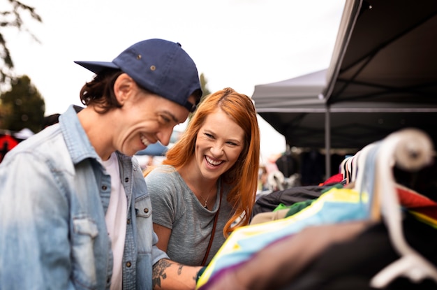 Smiley people looking at clothes side view