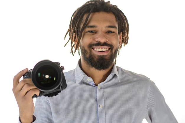 Smiley photographer holding camera