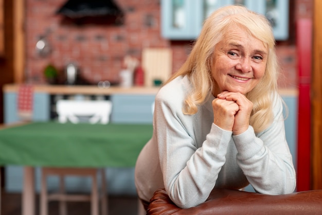 Smiley senior woman at home