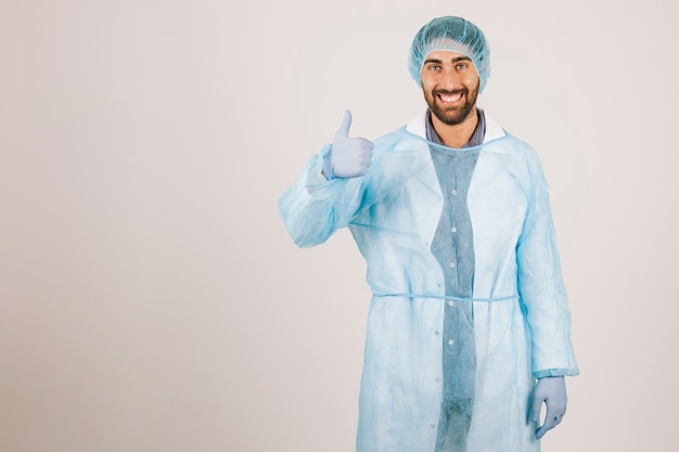 Smiley surgeon posing with thumb up