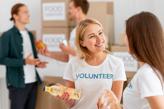 Smiley volunteers preparing food provisions for donation