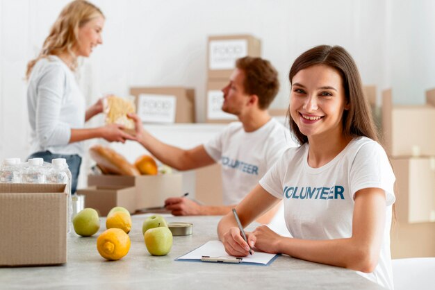 Smiley volunteers working to donate food