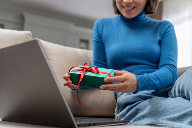 Smiley woman holding gift