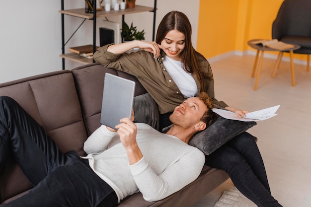 Smiley woman and man making plans to renovate the household together