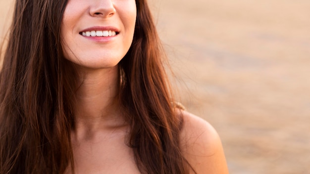 Smiley woman outdoors in nature with copy space