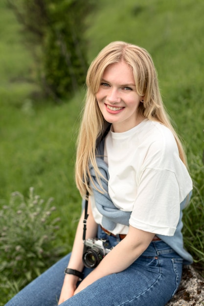 Free Photo smiley woman posing in nature