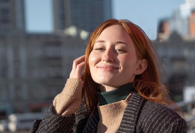 Smiley woman posing outdoors