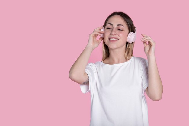 Smiley woman posing with white shirt medium shot