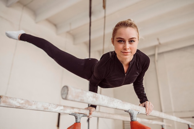 Smiley woman training for gymnastics championship