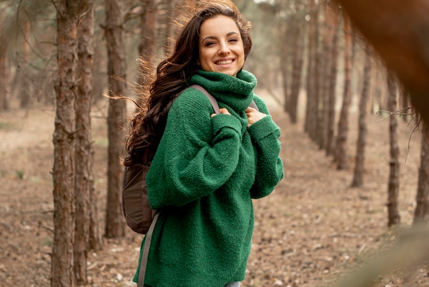 Free photo smiley woman traveling with backpack