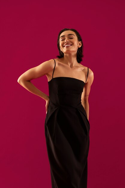 Smiley woman wearing black dress front view