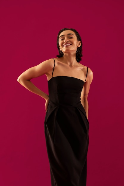 Smiley woman wearing black dress front view