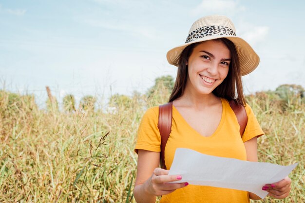 Smiley woman wearing a hat looking directly at the camera