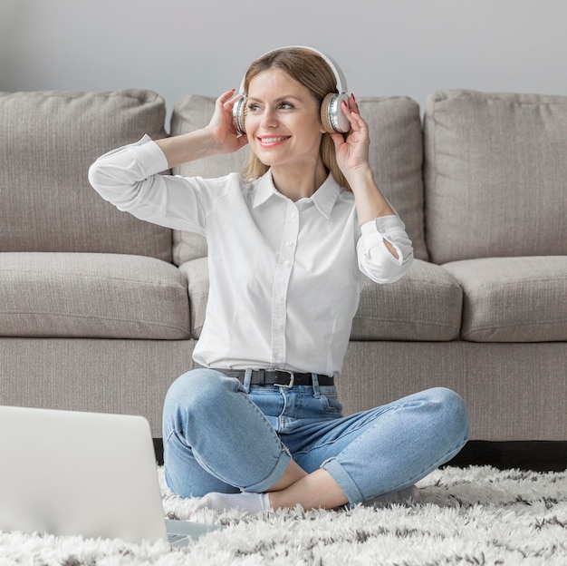 Smiley woman wearing headphones