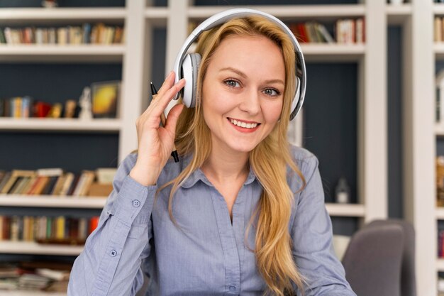 Smiley woman wearing headphones