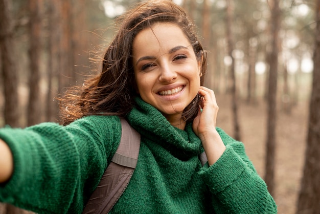 Smiley woman with backpack