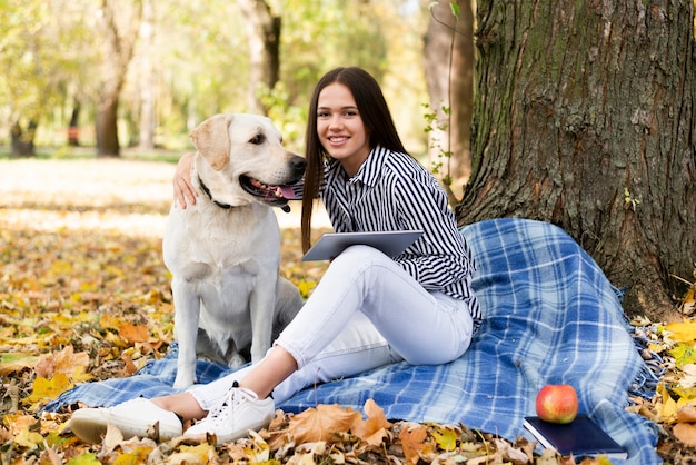 Smiley woman with cute labrador