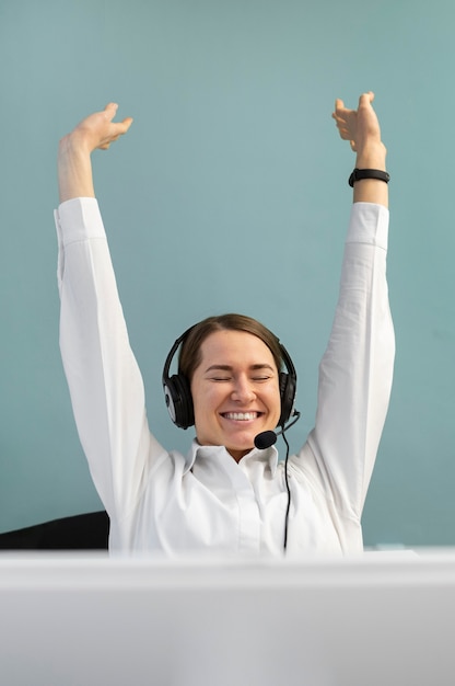 Free Photo smiley woman working in a call center office