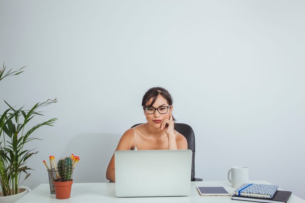 Smiley woman working at her desk