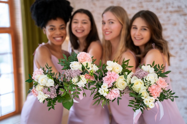 Smiley women celebrating engagement with flowers