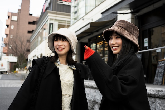 Smiley women in city medium shot