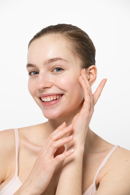 Smiley young woman posing side view