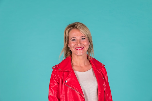 Smiling aged woman in red wear