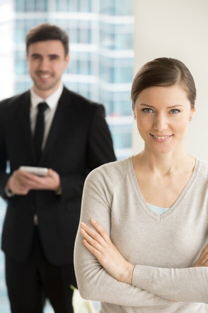 Smiling beautiful businesswoman looking at camera