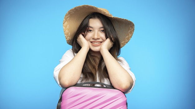 Smiling beautiful girl in hat goes on holiday wants to rest