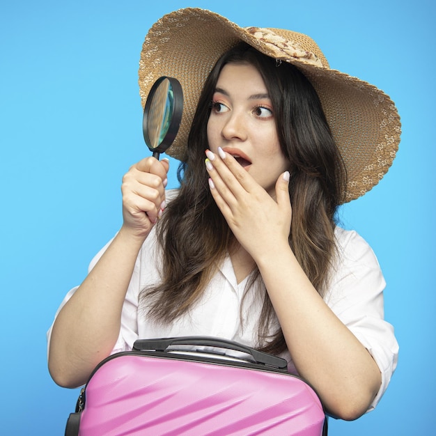 Smiling beautiful girl in hat goes on holiday wants to rest