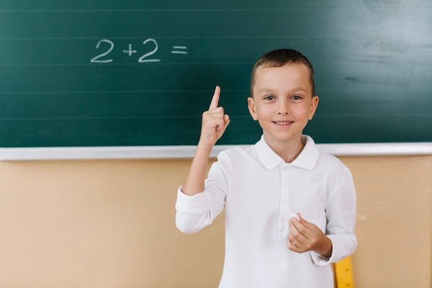 Smiling boy in math class