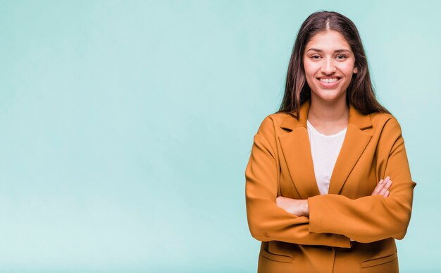 Smiling brunette girl posing with coat