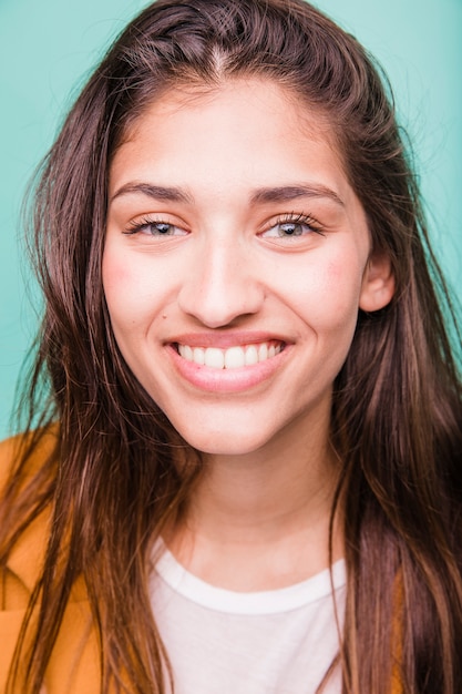 Smiling brunette girl posing with coat