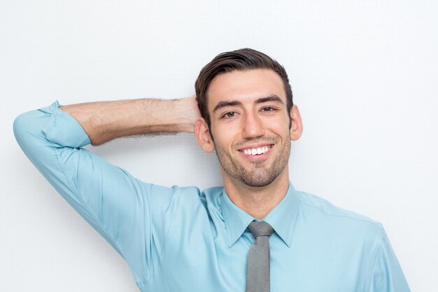 Smiling Business Man With Hand Behind Head