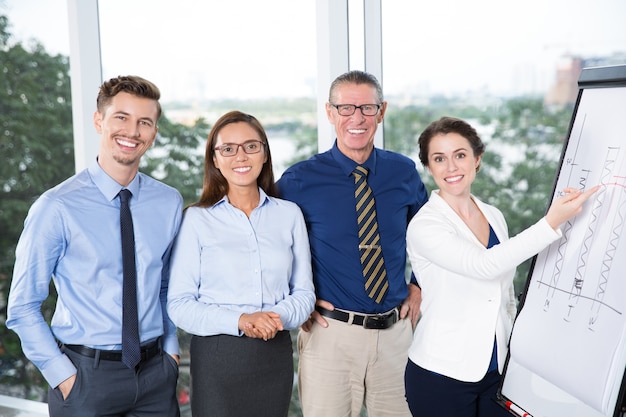 Smiling Business Team at Presentation in Office