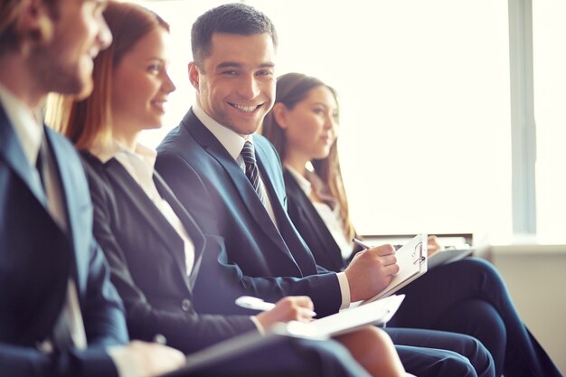 Smiling businessman in a convention