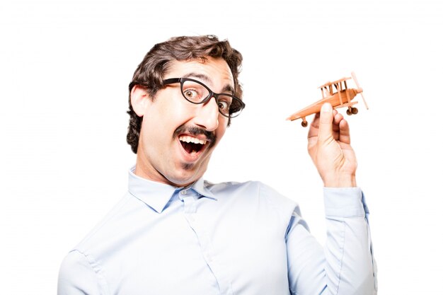 Smiling businessman with toy plane