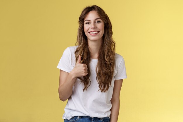 Smiling cheerful  woman gives thumb up