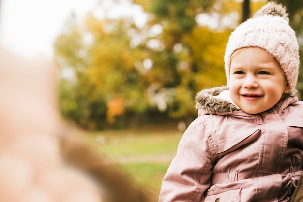 Free Photo smiling child in autumn park