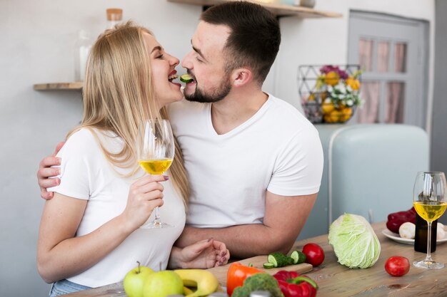 Free photo smiling couple cooking together