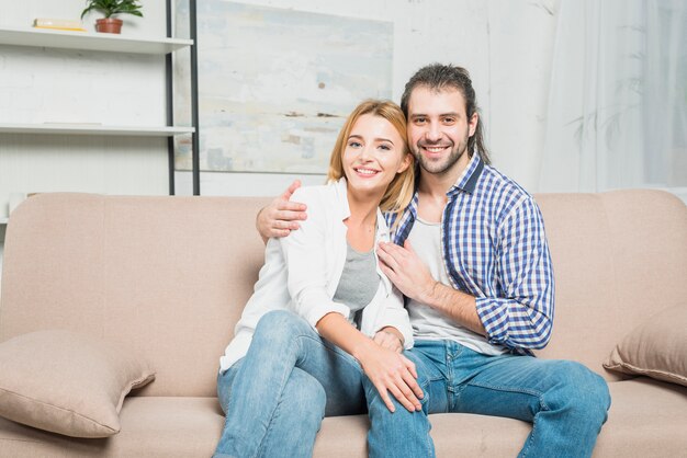 Smiling couple on the sofa