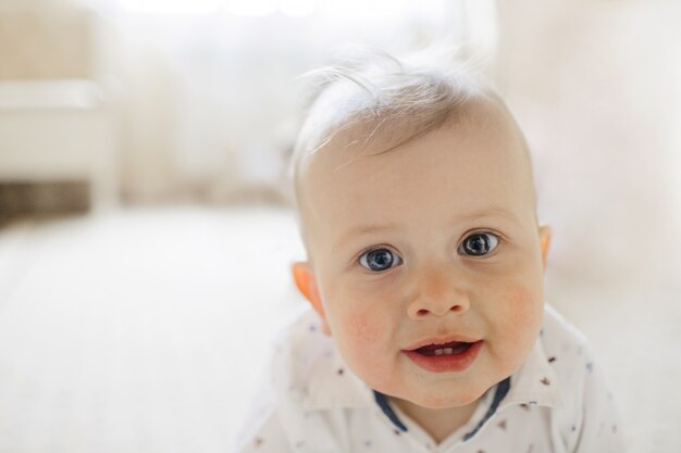 smiling  cute blue-eyed baby